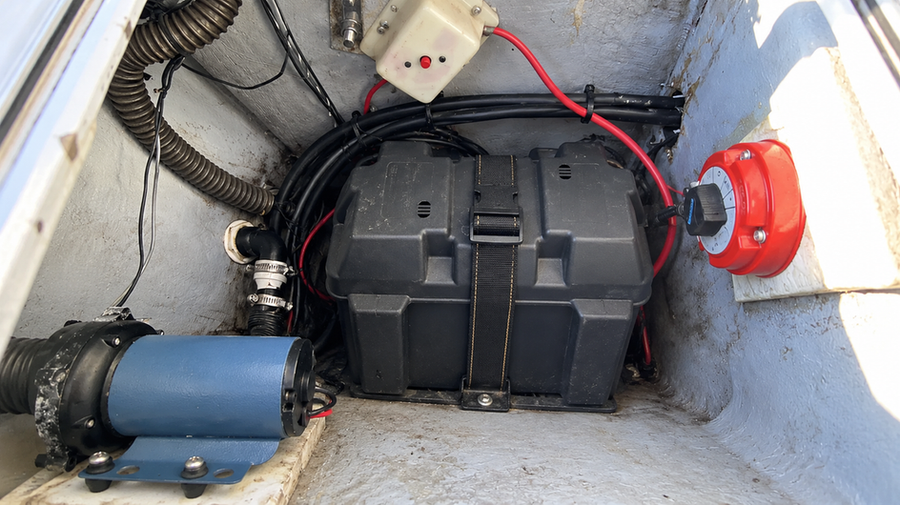 Single secured battery in a small boat powering modest onboard electronics